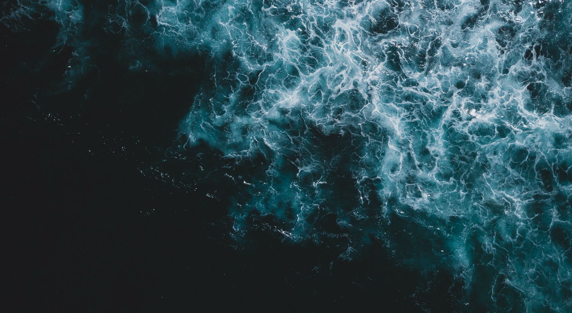 swirling dark blue water waves